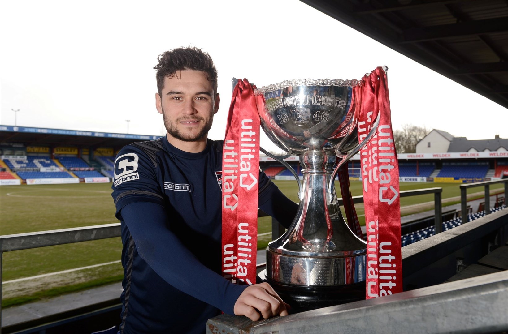 Former Ross County striker with the League Cup trophy, which he lifted in 2016.