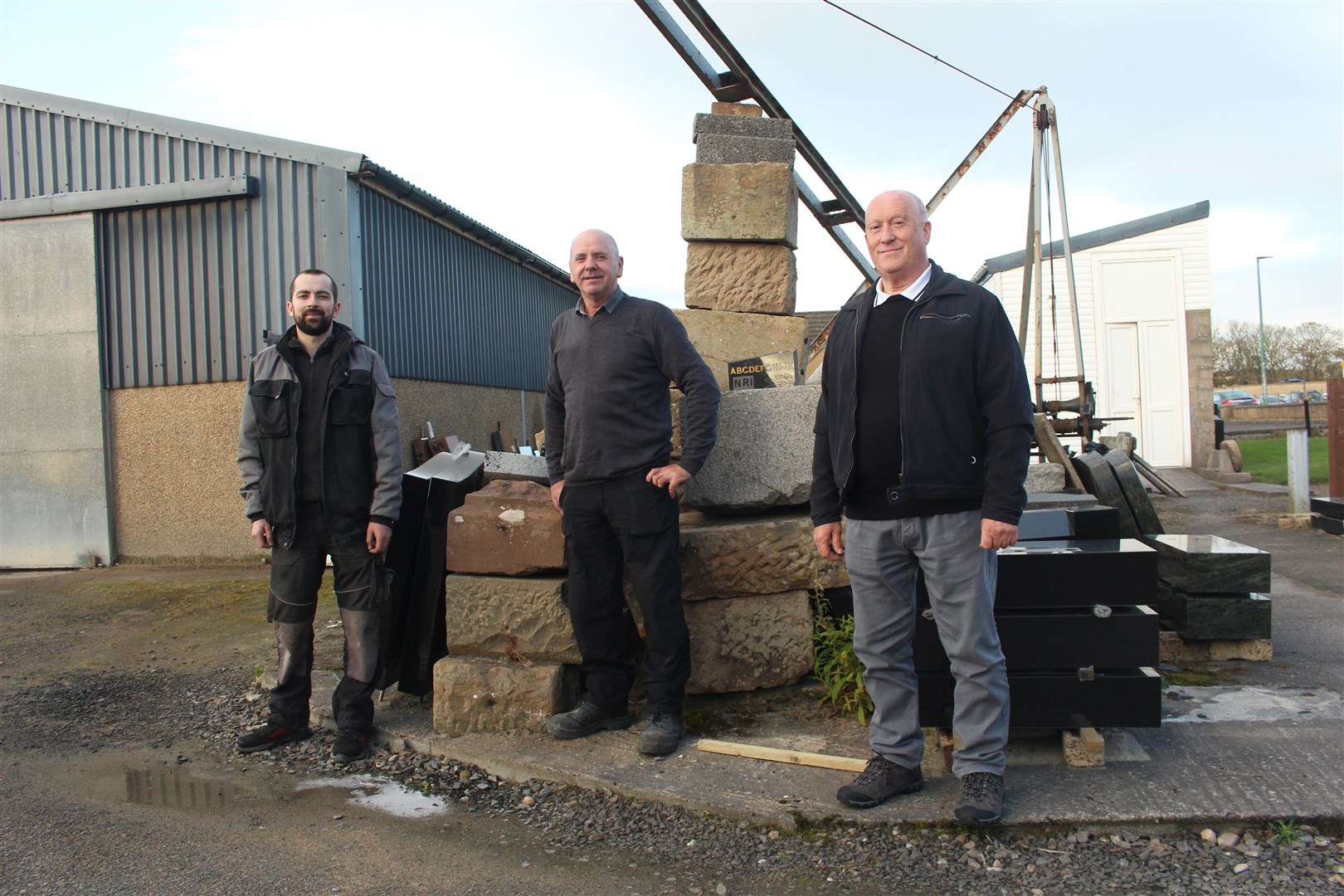 Directors Steven Nicolson, Willie Wydmuch and Gordon Fraser in the yard of John Hood & Son in Wick.
