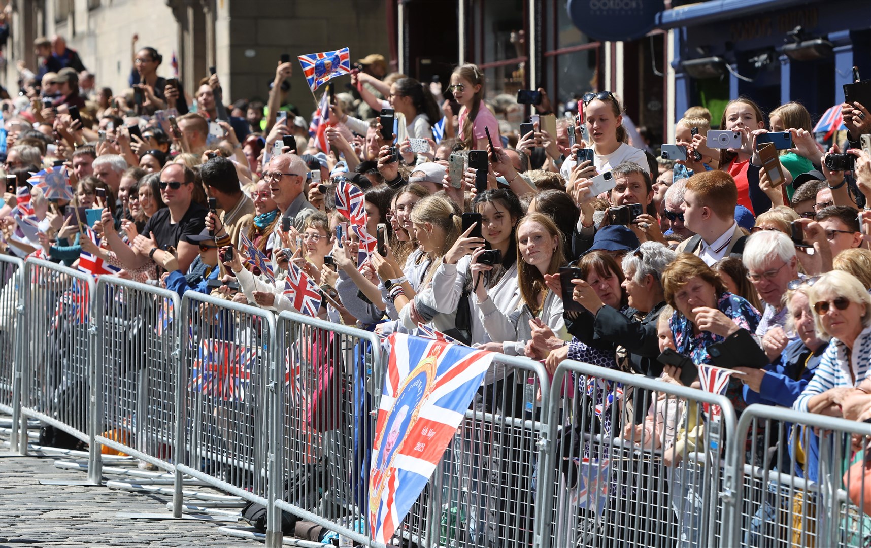 Crowds watch the procession on the Royal Mile (Colin Mearns/Herald & Times Group/PA)