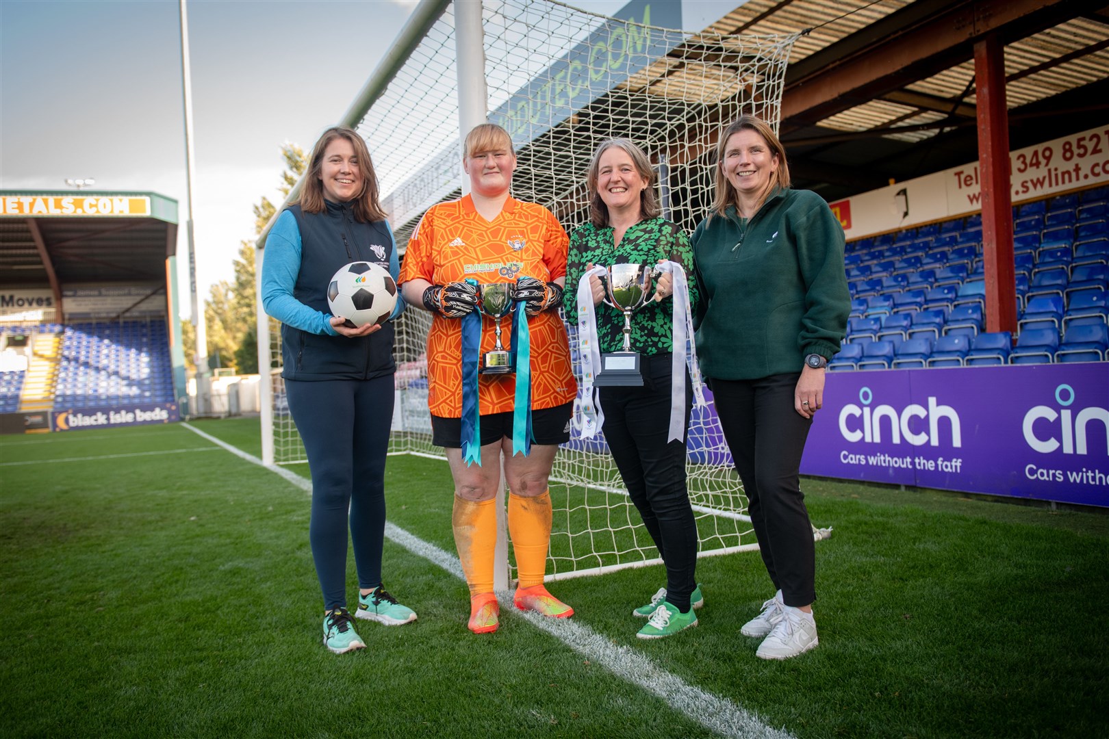SWF CEO Aileen Campbell, double-winning Buckie goalkeeper Sophia Golebiewski, sports minister Maree Todd and title sponsors ScottishPower's director of engagement Hazel Gulliver visited Ross County's stadium for Scottish Women and Girls in Sport Week. Picture: Callum Mackay