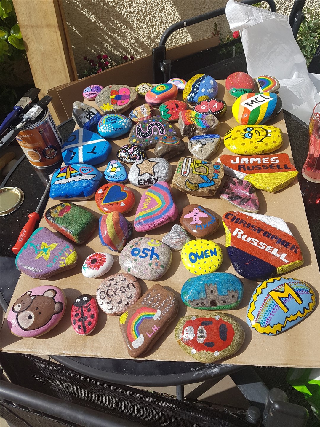 Suzie Legge and family are being kept busy varnishing hundreds of painted stones.