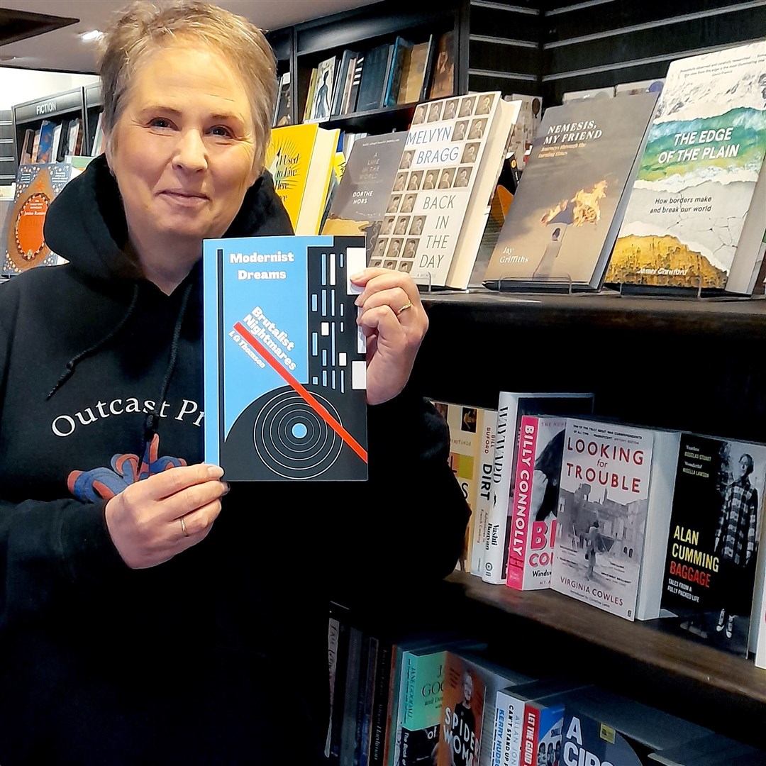LG Thomson with her book, Modernist Dreams Brutalist Nightmares, at the Ceilidh Place Bookshop in Ullapool.