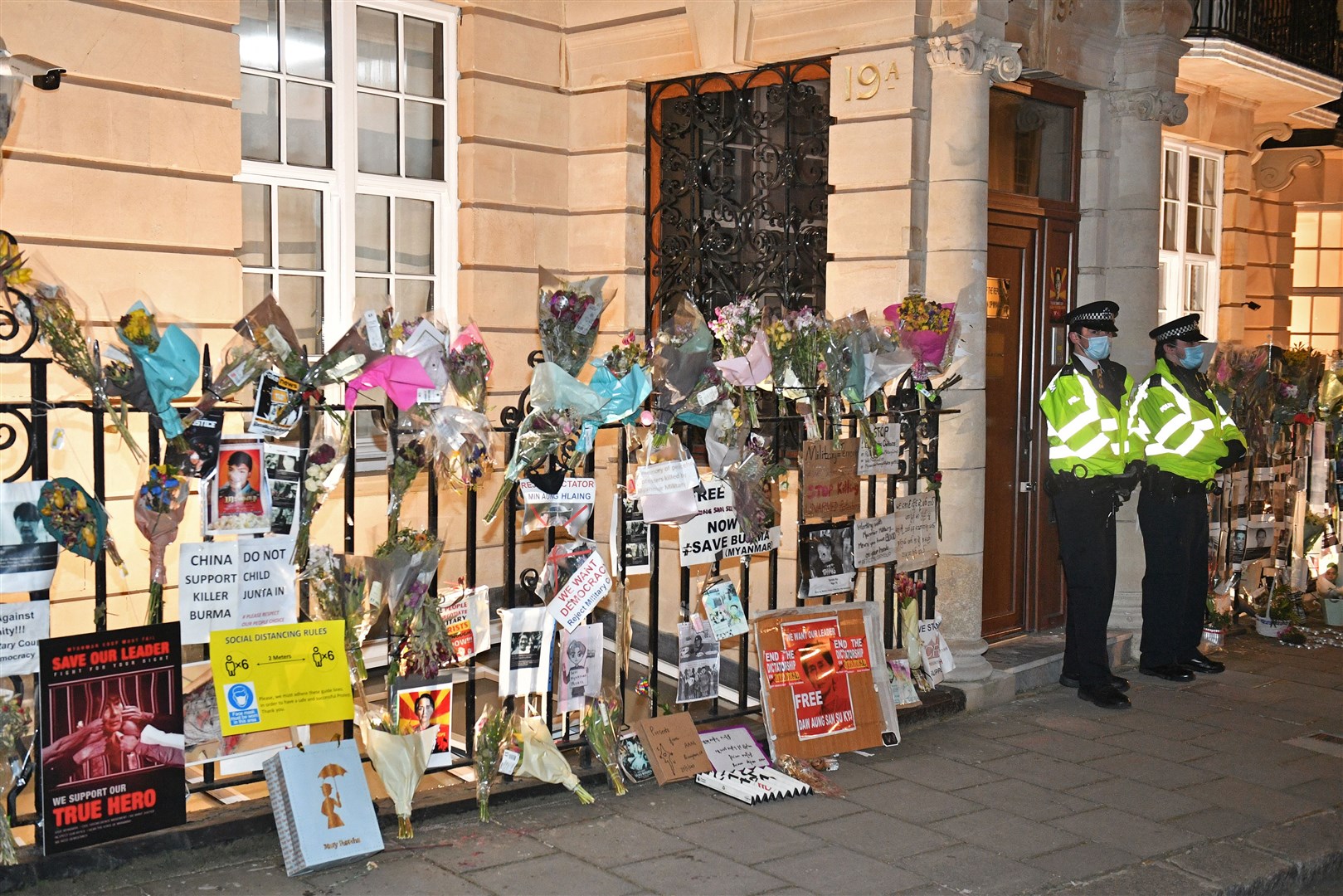 Flowers have been left outside the embassy (Dominic Lipinski/PA)