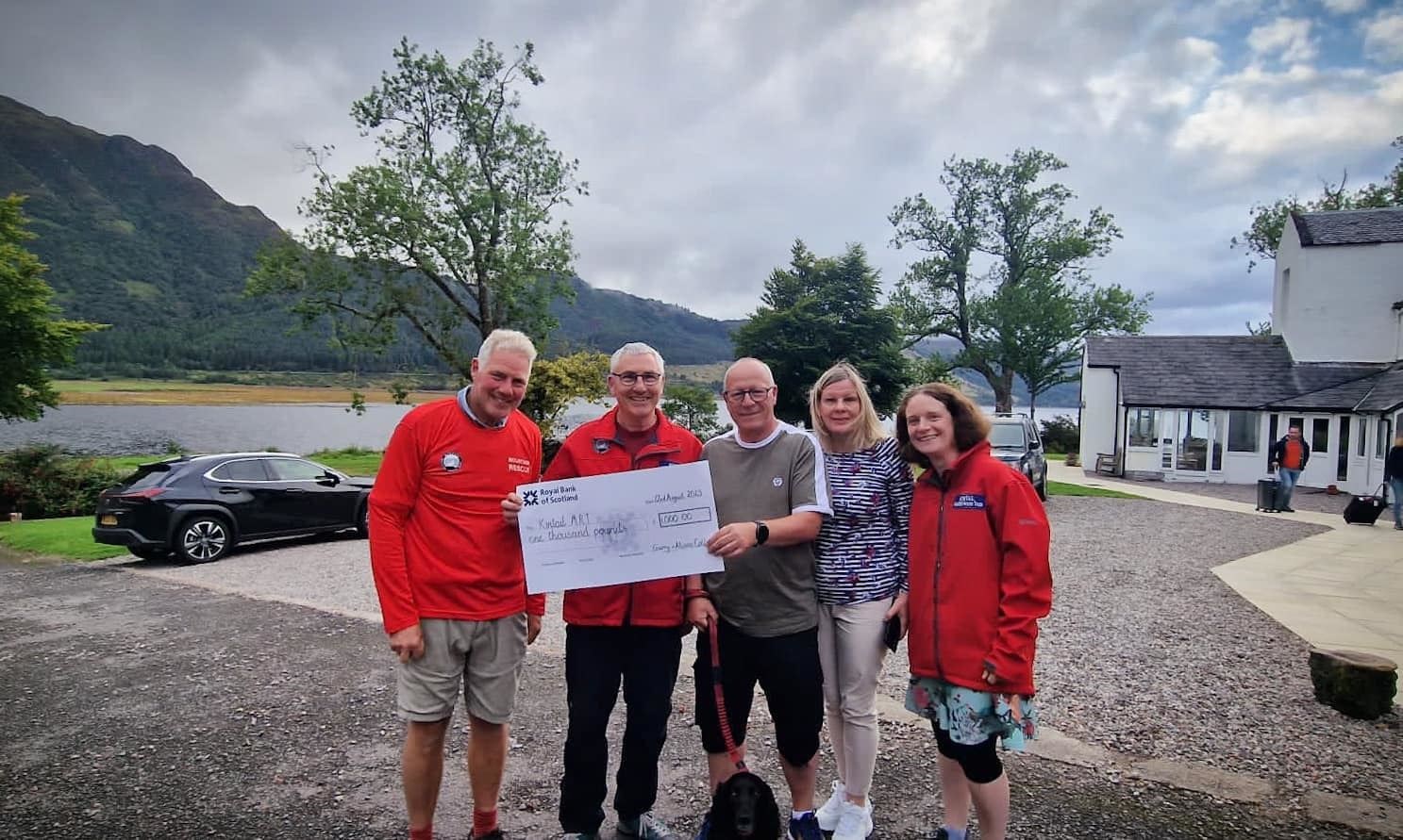Kintail Mountain Rescue team members with Garry Collins who made a donation after he was rescued earlier this year. Picture: Kintail MRT