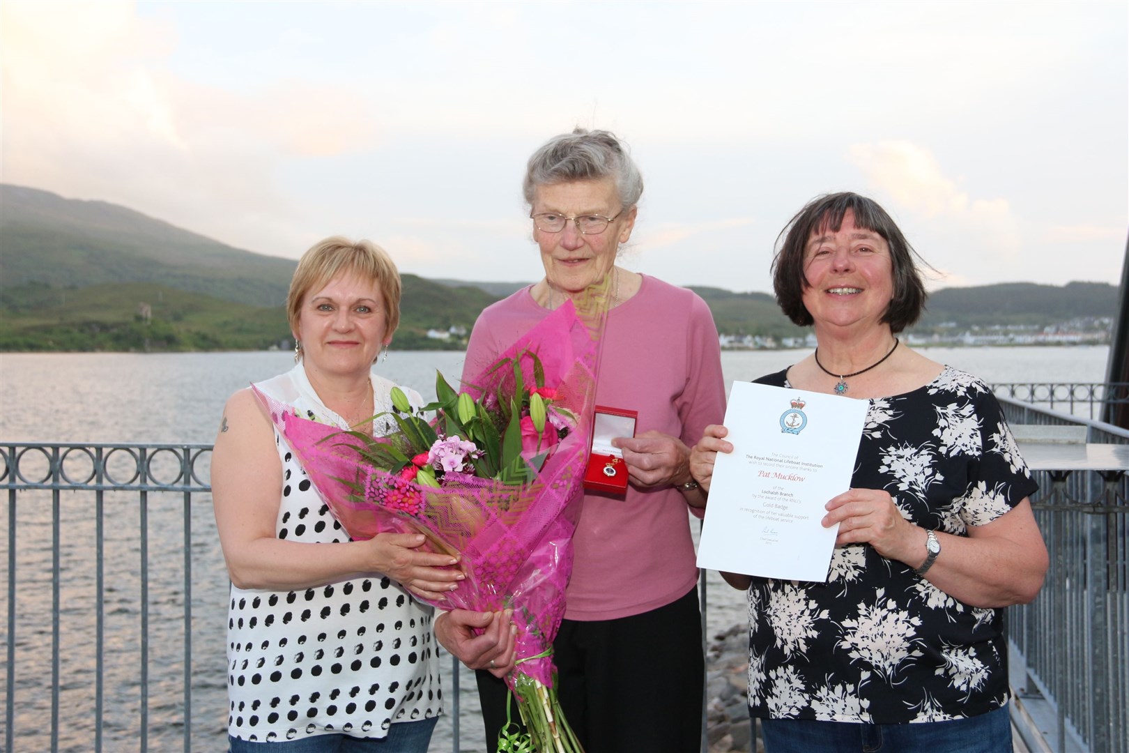 The late Pat Mucklow (centre) when she was awarded her gold medal. She is flanked by Ina Finlayson and Audrey Sinclair. Picture: Kyle RNLI