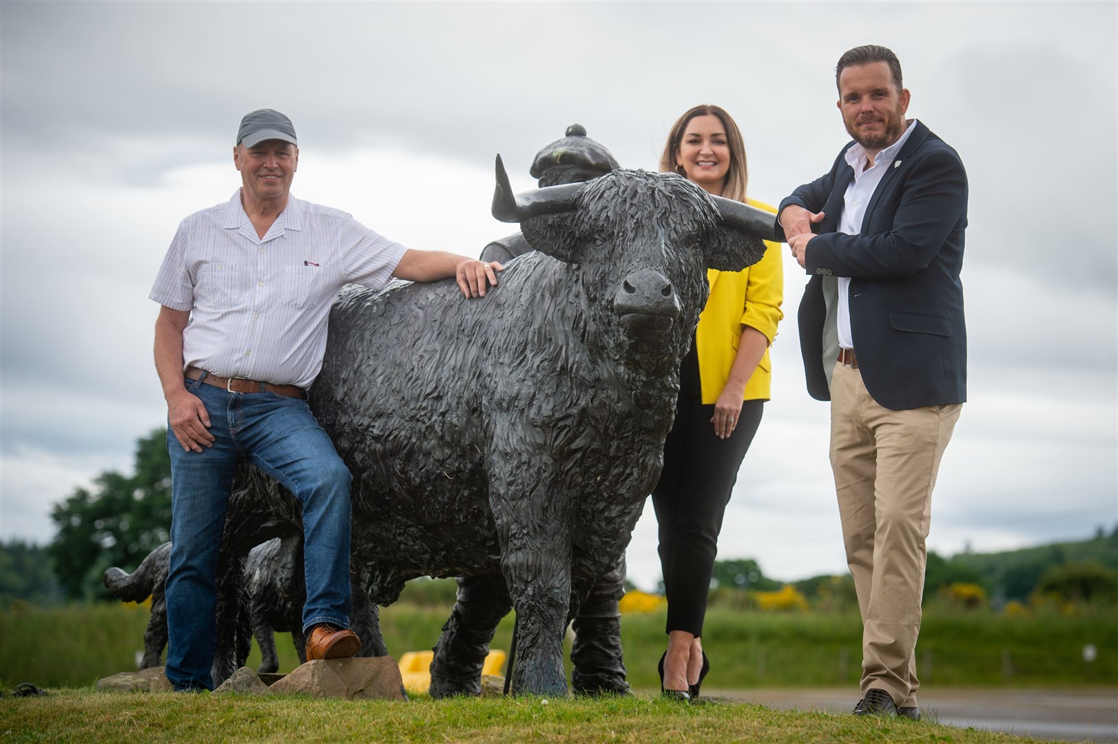Auction chairman David O'Connor with Emma Nicol, Highland Hospice fundraiser, and Andrew Benjamin, Maggie's Highlands fundraising manager. Picture: Callum Mackay