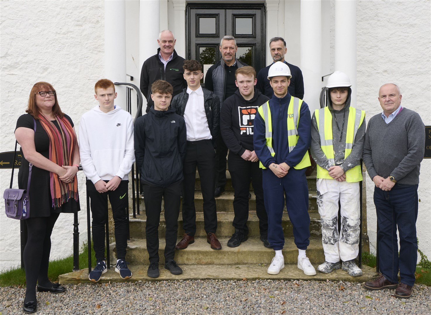 The Tulloch Homes new boys and their mentors. Back row from left, Hugh Macgillivray, Gordon Macallister and Dave Macdonald. Front from left are Pauline Tuthill, apprentices Scott Cameron, Arran Legge, Ronnie Fraser, Ewan Bremner, Riley Barclay and Dylan Lowry with David Patience.