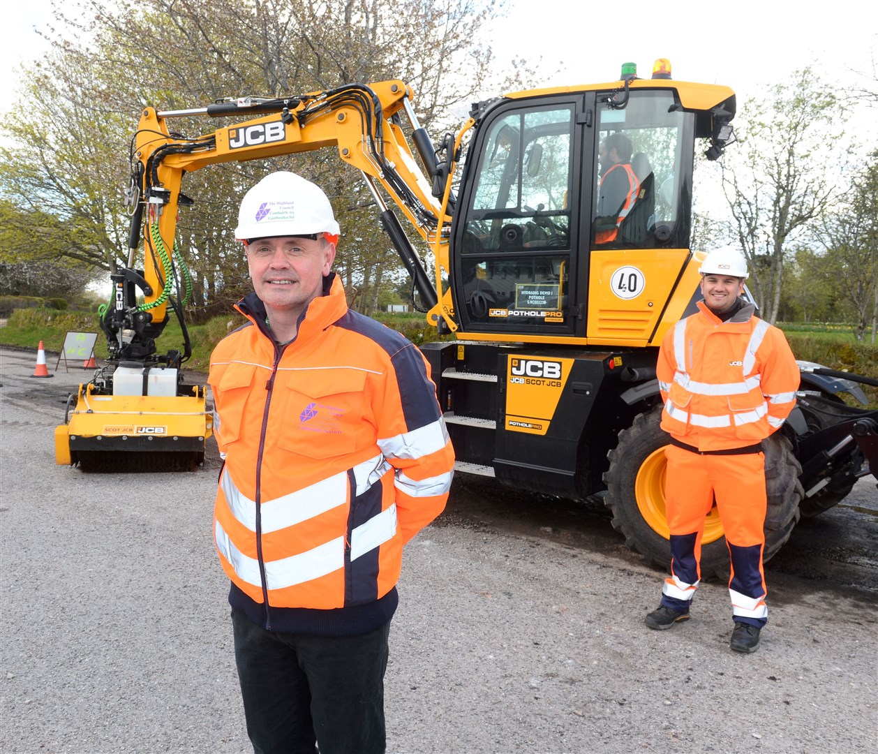 JCB's brand-new PotholePro arrives in the Highlands for Highland Council to see a demonstration. Highland Council's Malcolm MacLeod (left) of infrastructure and environment with Paul Swallow of JCB Hydradig. Picture: Gary Anthony.