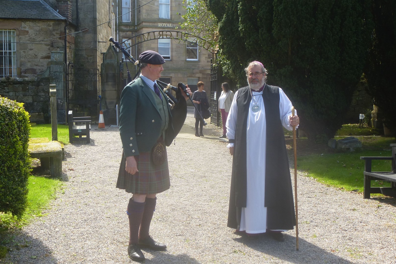 The service of redidication took place in Tain. Duncan Macgillvray, piper talking to the Bishop Mark Strange.