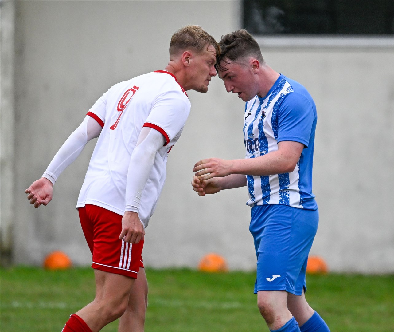 Player-manager John Maclellan and Inver full back Calum Robinson go head to head before both were dismissed. Picture: Scott Macdonald