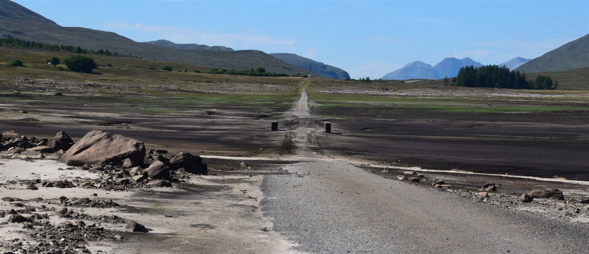 Looking west along the old road, back towards the first of two road bridges, with An Teallach visible in the far distance. Picture: Phil Murray