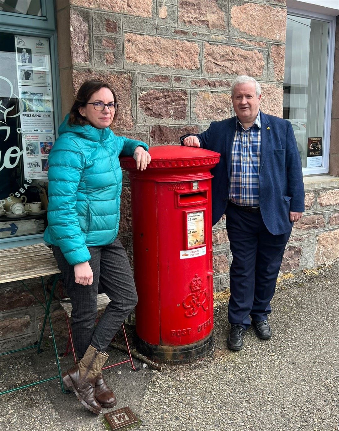 Parliamentary candidate Lucy Beattie and MP Ian Blackford, beside a post box in Ullapool.