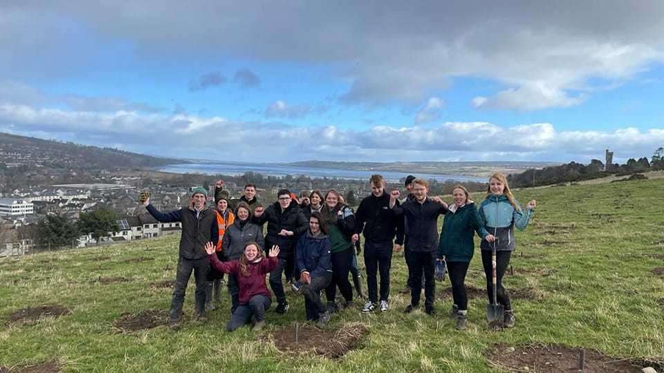 Pupils from Dingwall Academy rolled up thedir sleeves and helped with the penultimate tree-planting session. Picture: Dingwall Community Woodland
