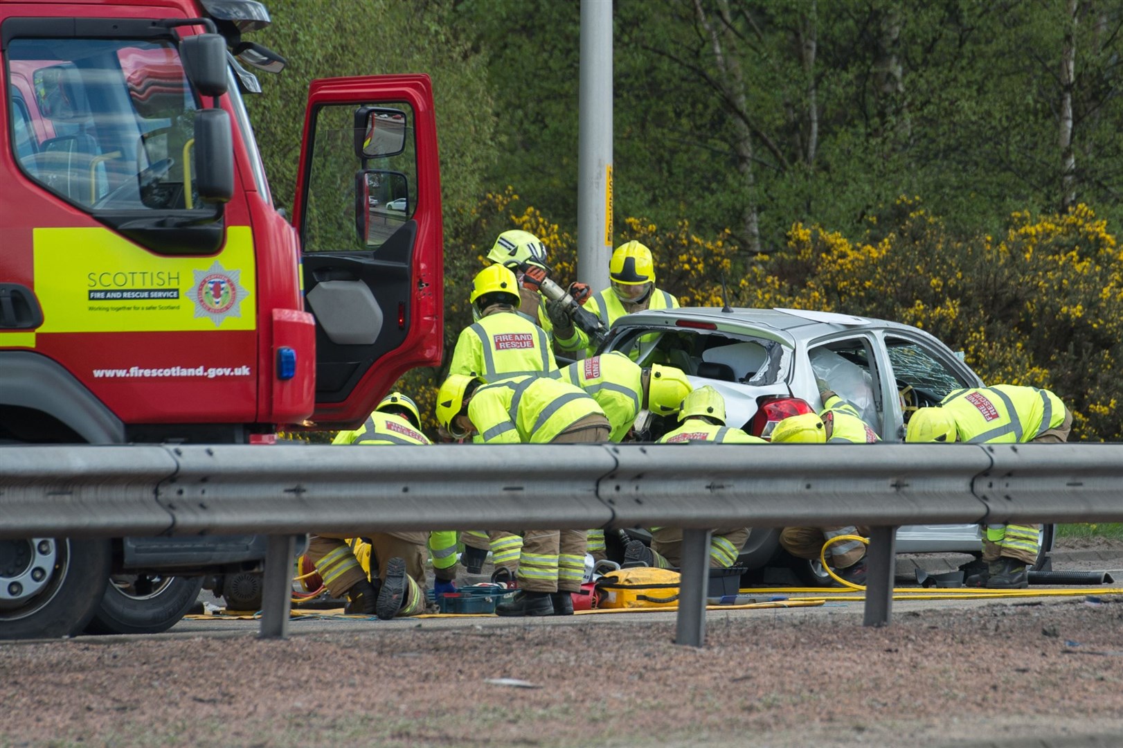 Firefighters at the scene following the crash.
