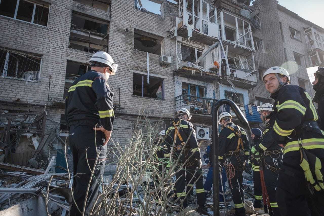 Firefighters working to prevent further damage within an attacked neighbourhood