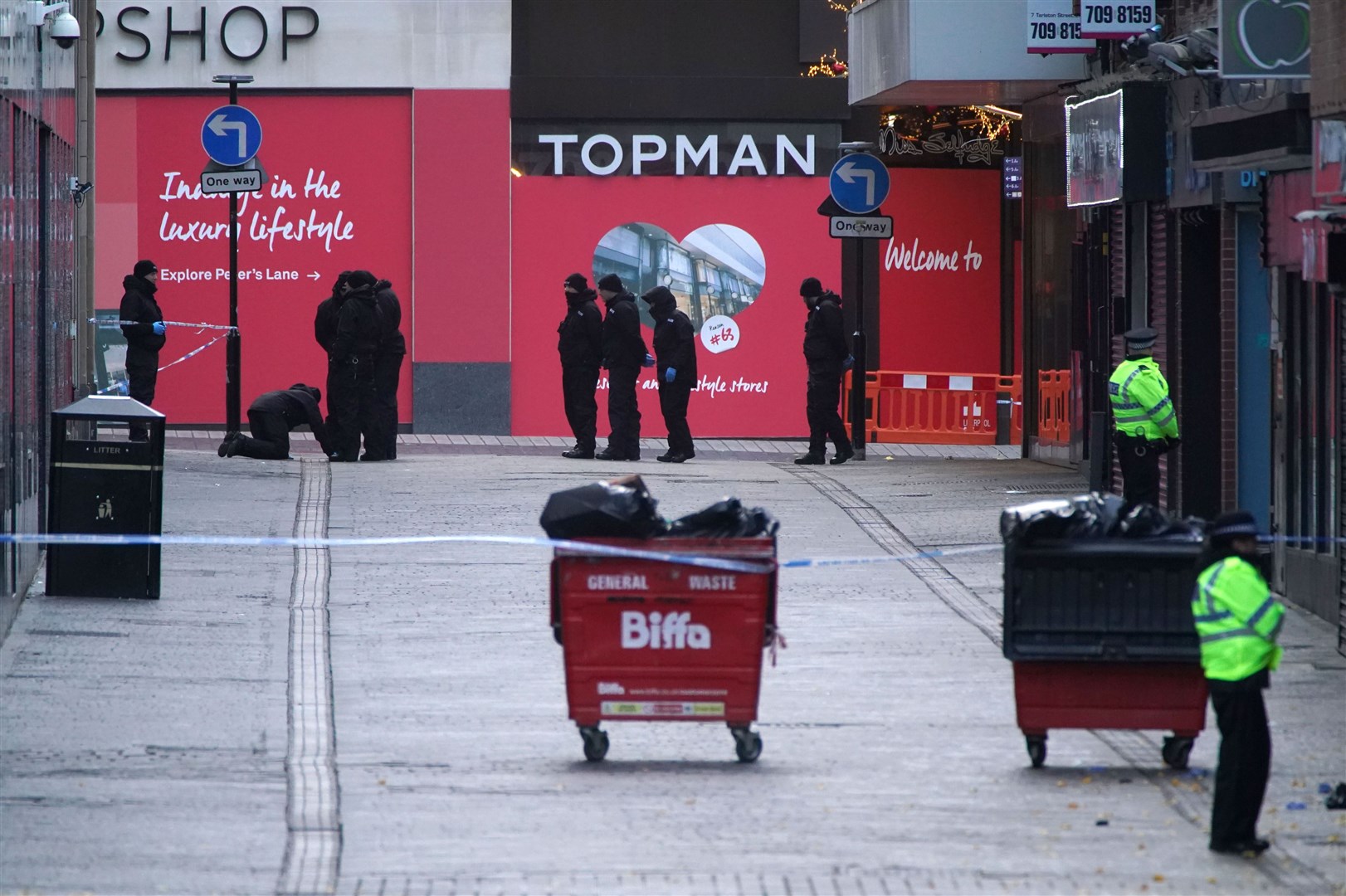 Police conduct a search near the scene in Liverpool city centre (PA)