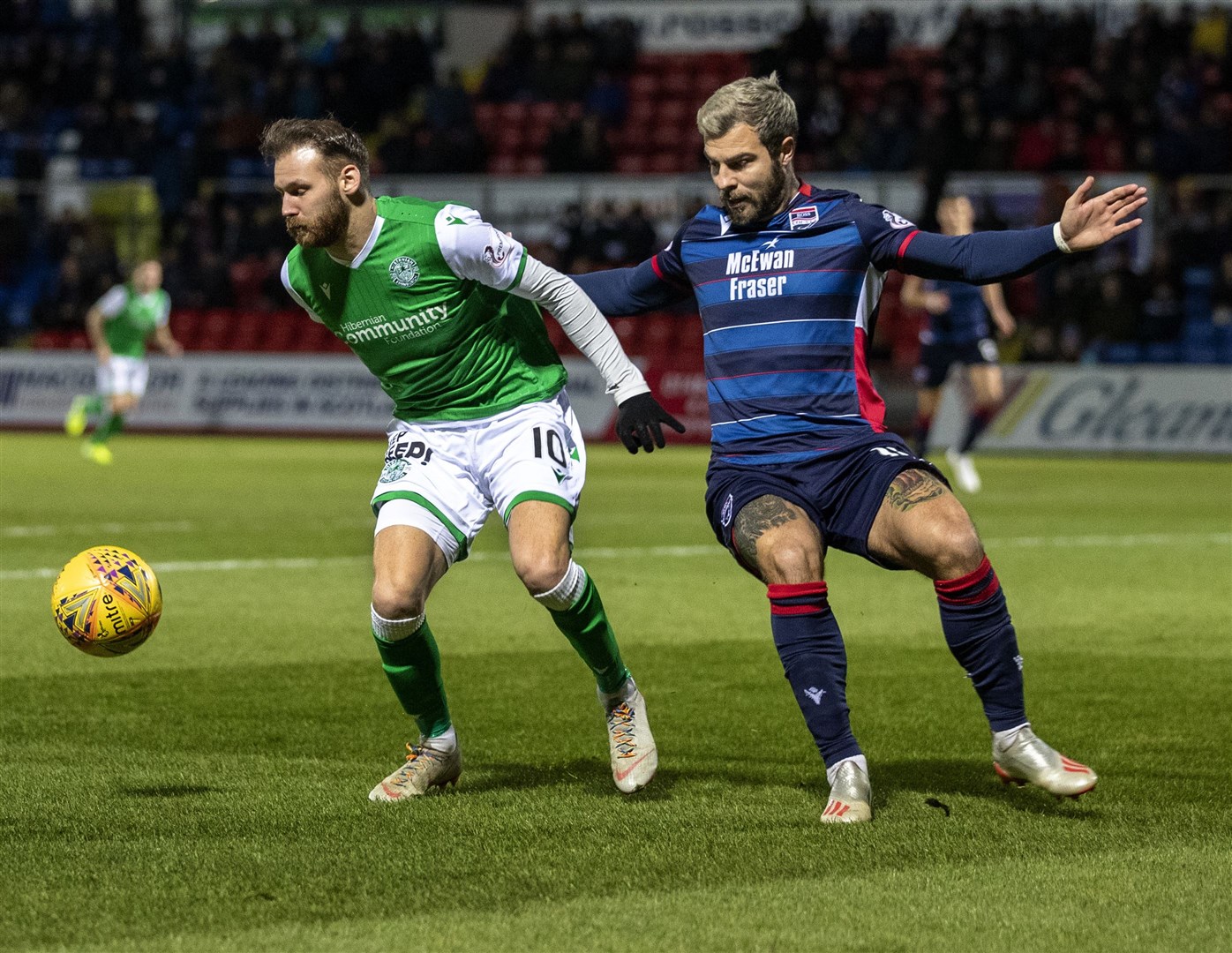 Richard Foster keeps track of Hibernian's Martin Boyle in the 2–1 win for Ross County in December. Picture: Ken Macpherson