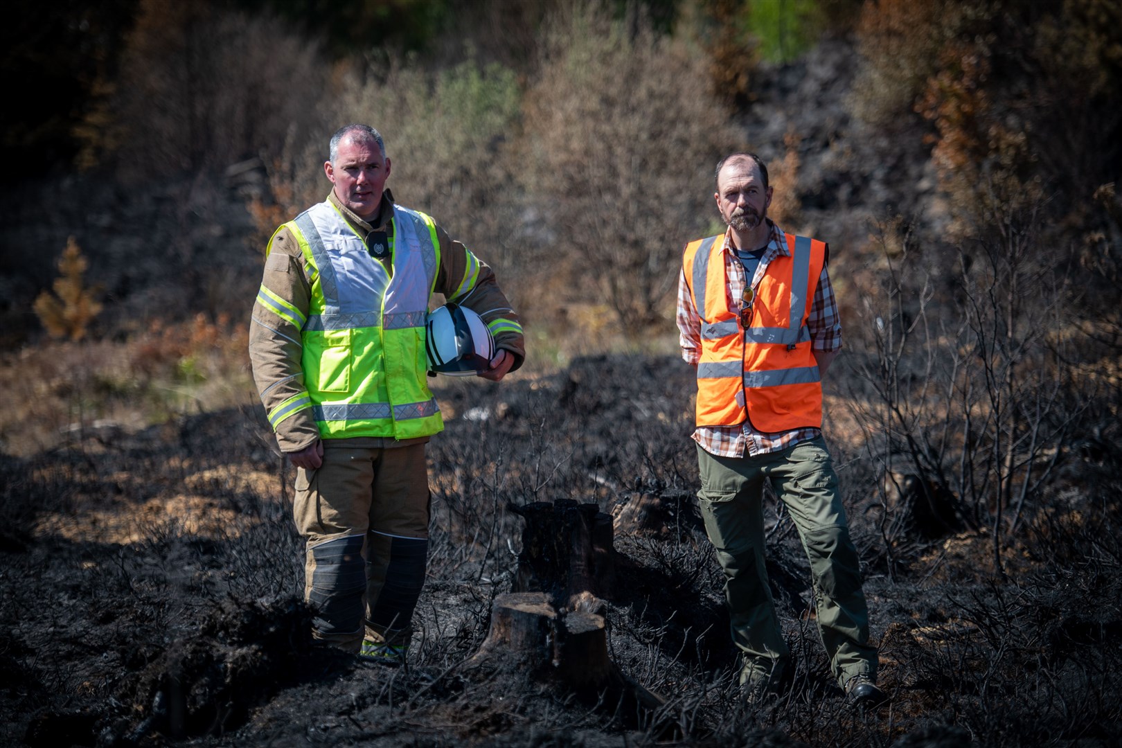 Jamie Thrower, Scottish Fire and Rescue Service Group Commander Highland North, and Simon McLaughlin RSPB site manager, survey the damage at Cannich last summer. Picture: Callum Mackay.