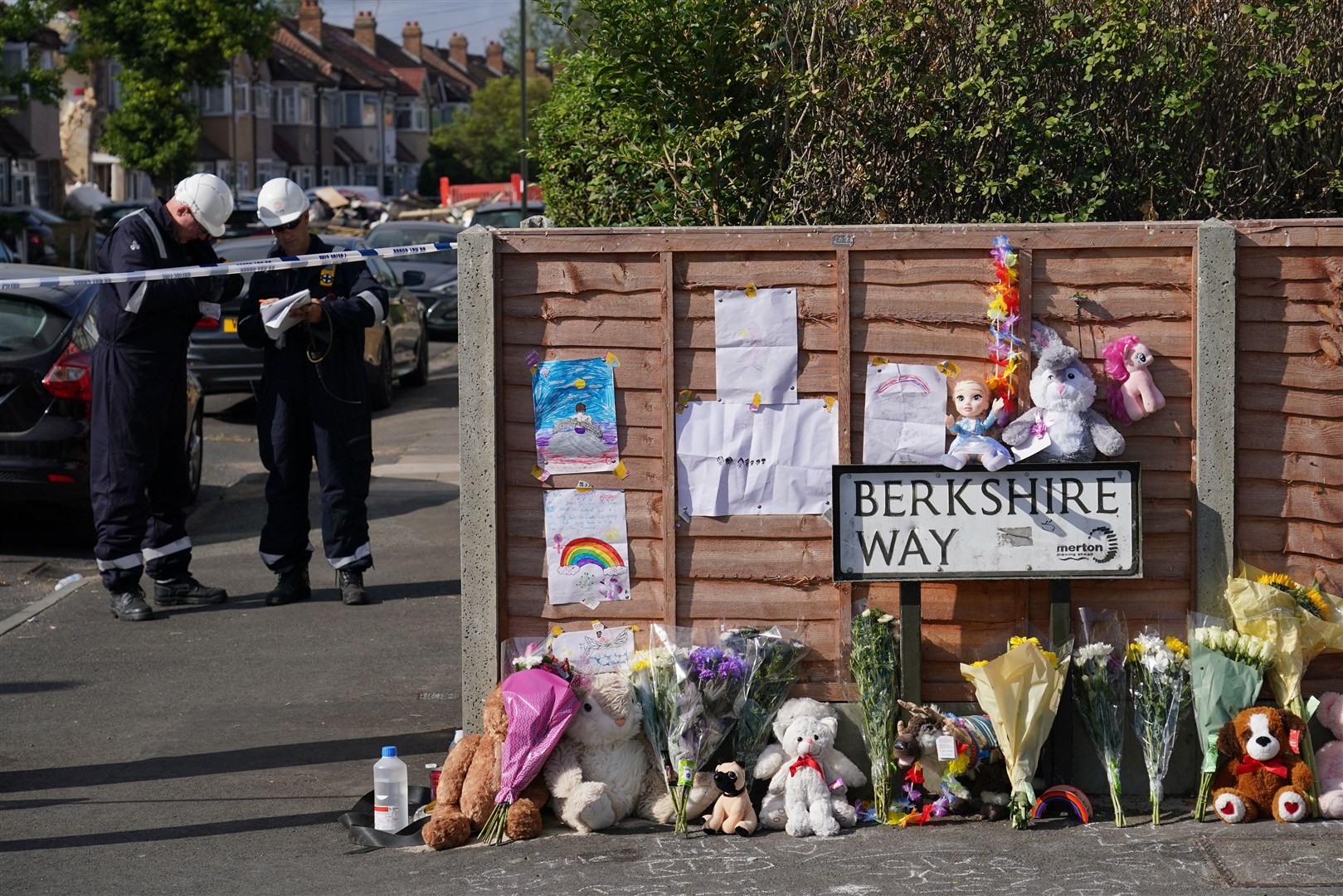 Flowers are laid near to the scene in Galpin’s Road (Dominic Lipinski/PA)