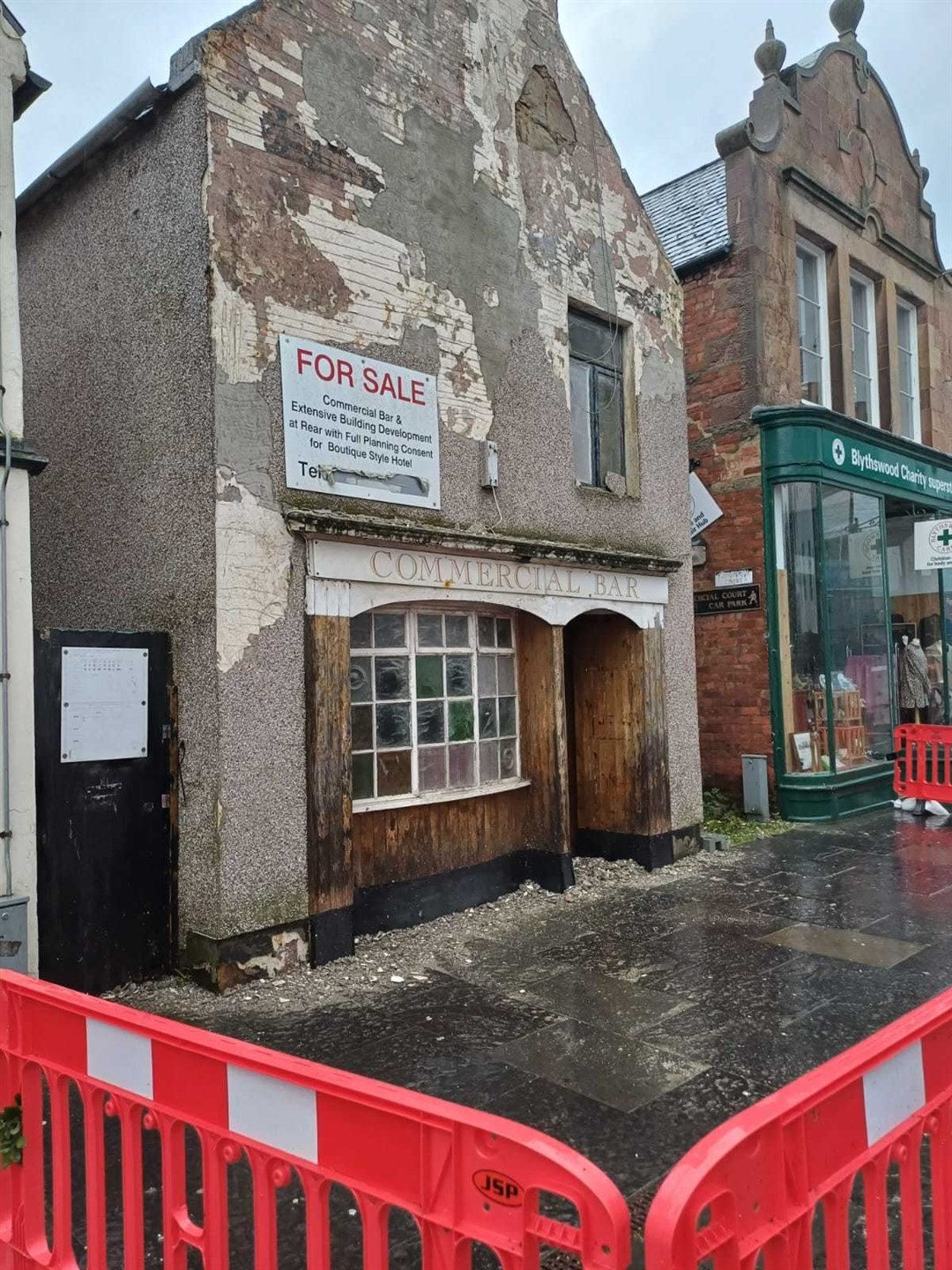 The Commercial Bar in Dingwall after the fire service had to hack off the unstable harling.