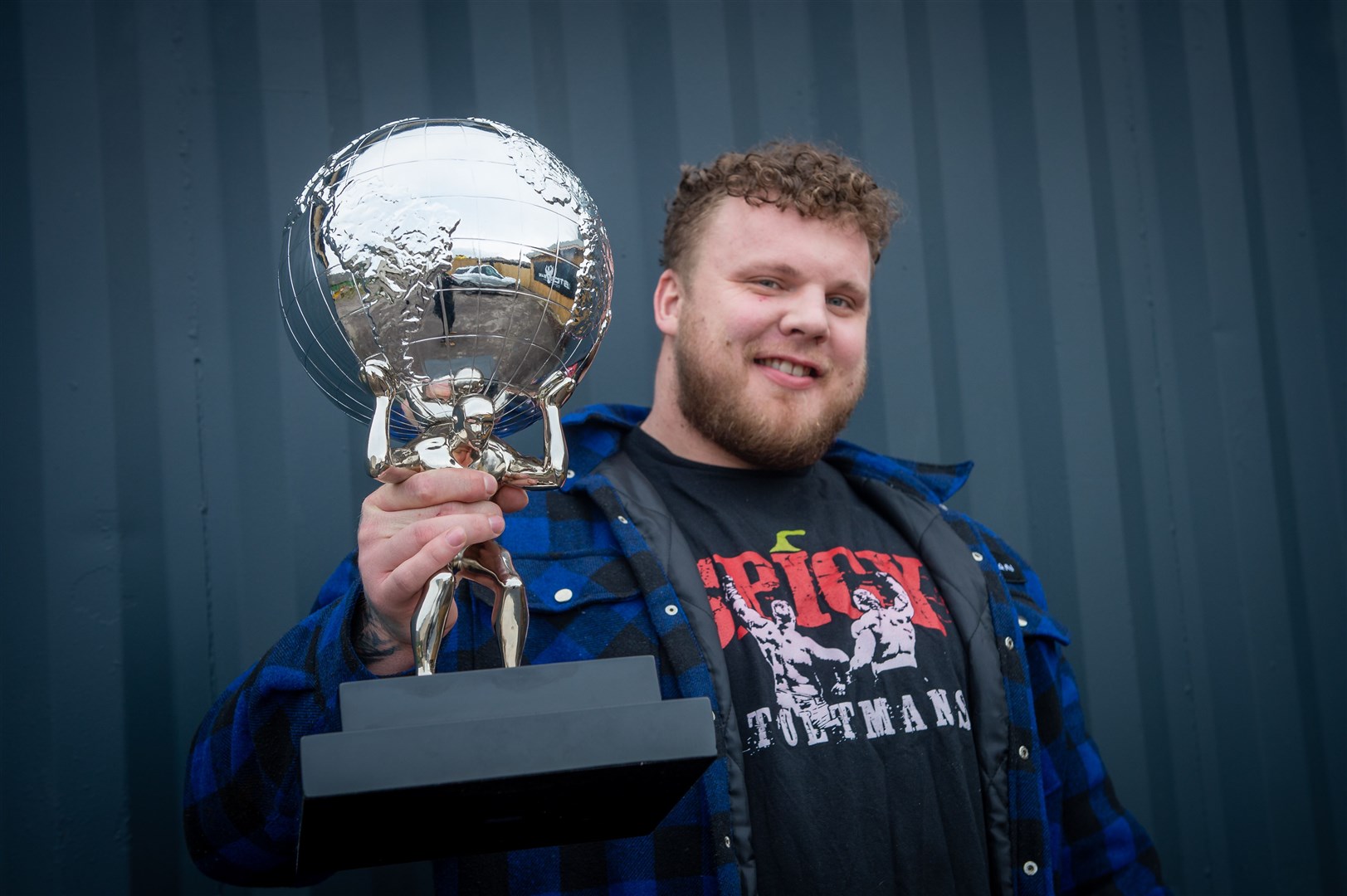 Tom Stoltman with the trophy he has now finally received from the US from his runner-up slot in World's Strongest Man comp.