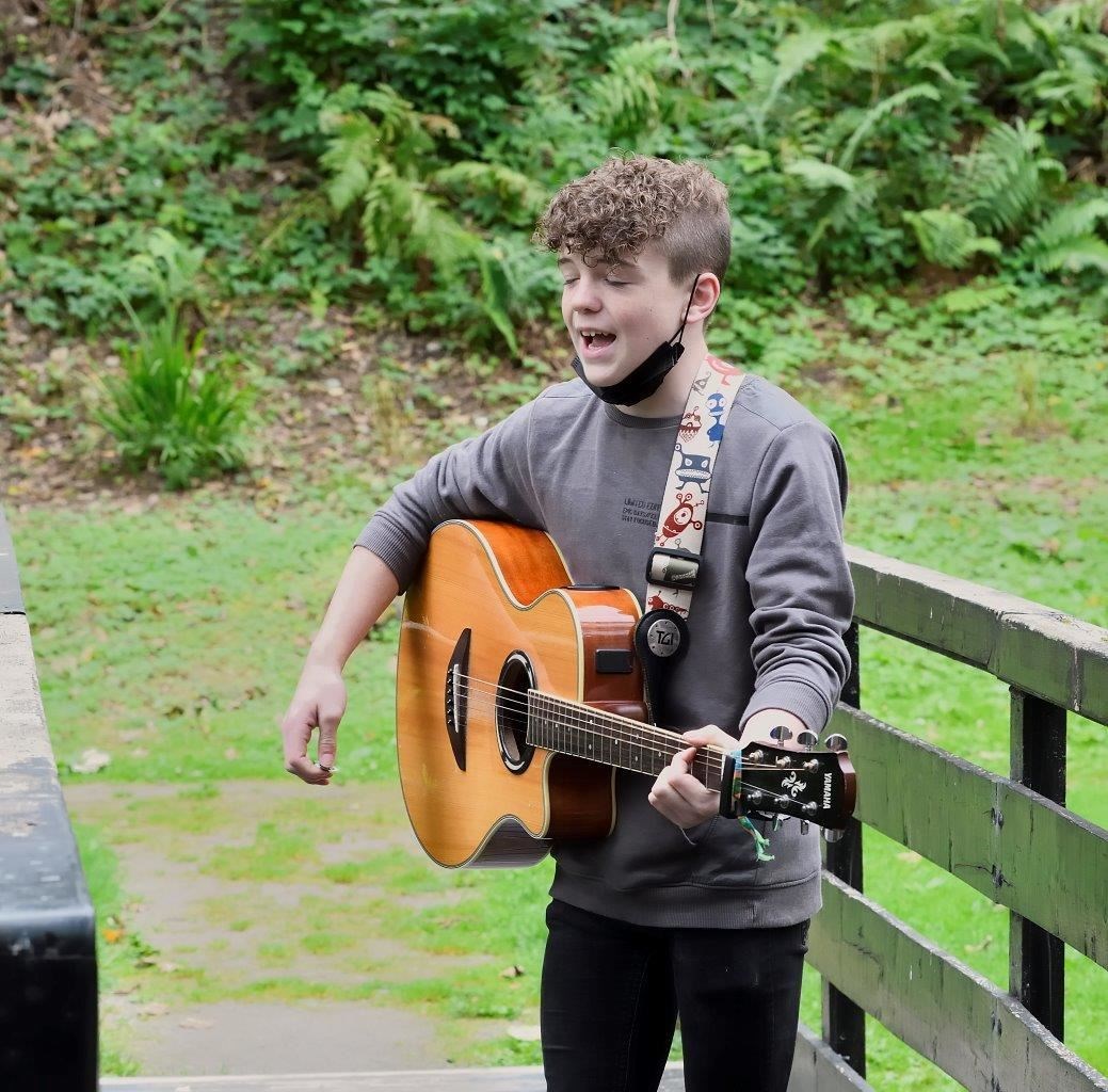 Young singer-songwriter James MacGillivray (13) entertaining diners at Strathpeffer.