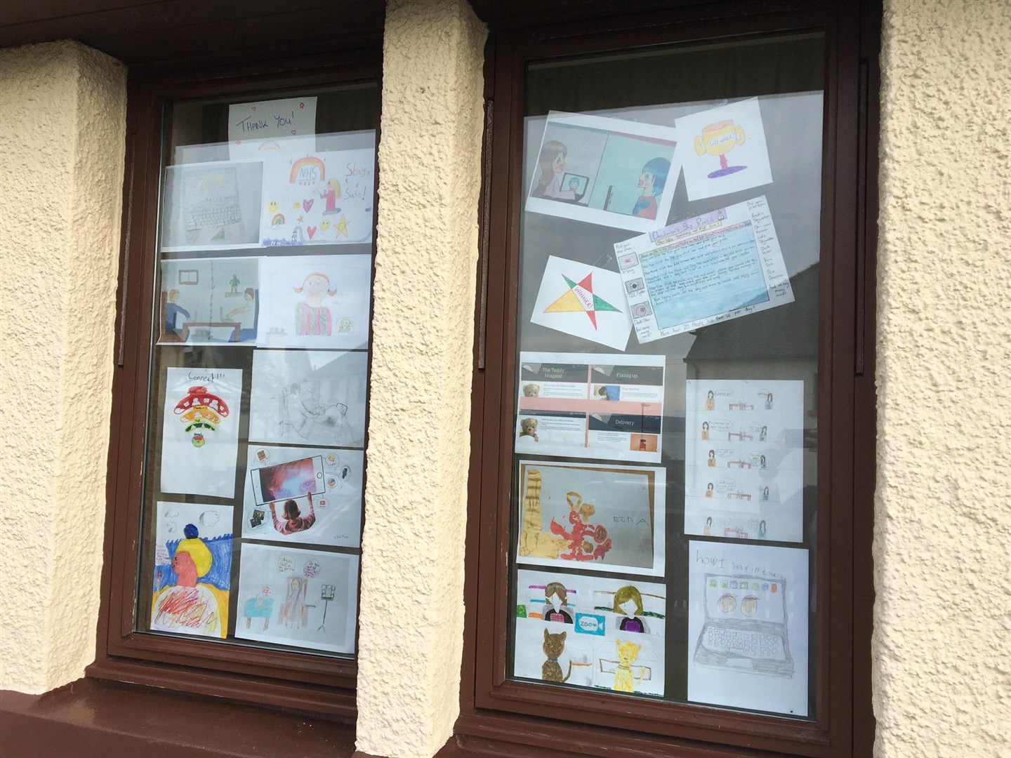 Entries posted in the Calico office window.