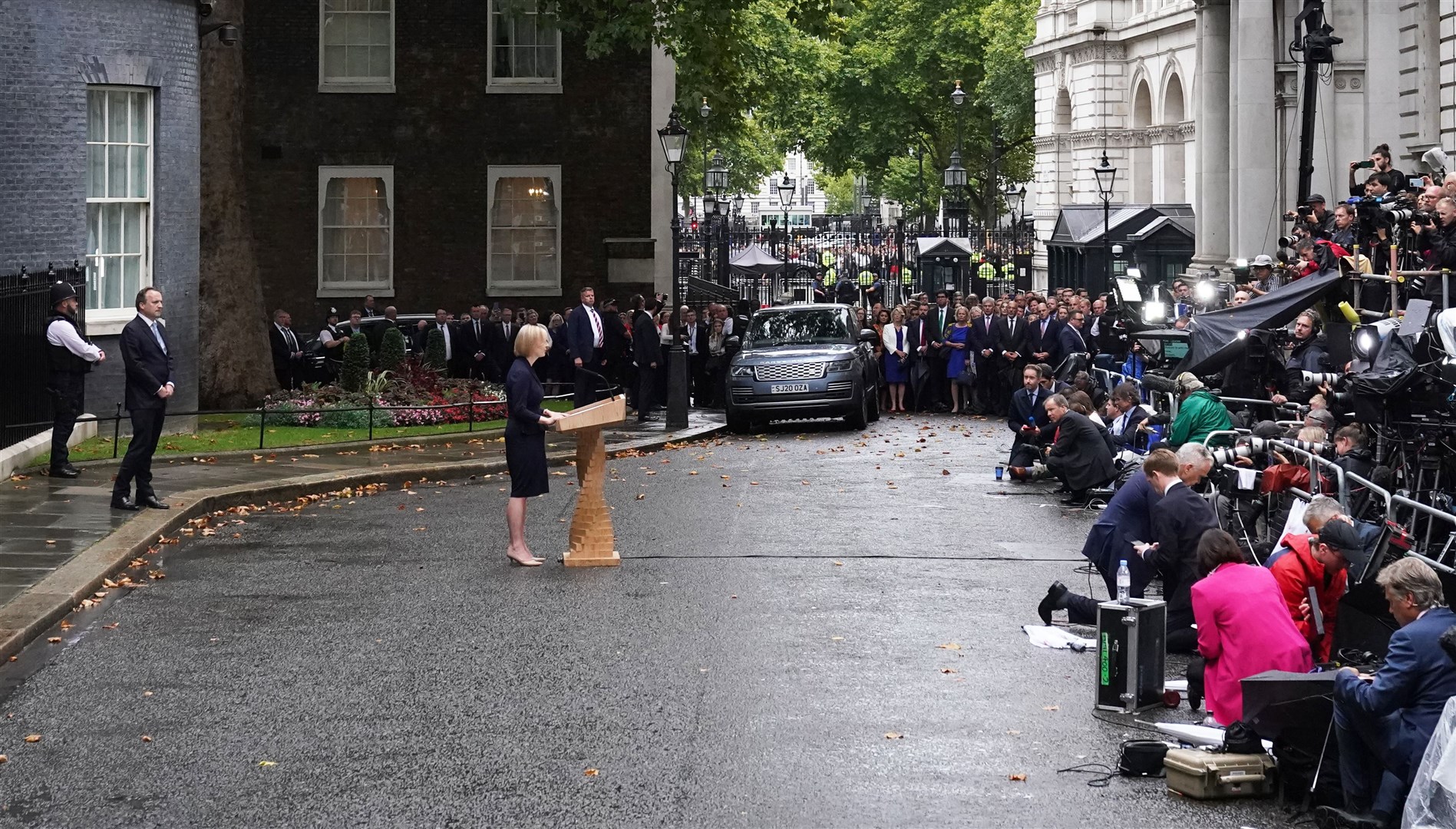 New Prime Minister Liz Truss made her speech outside 10 Downing Street, despite the changeable weather (Victoria Jones/PA)