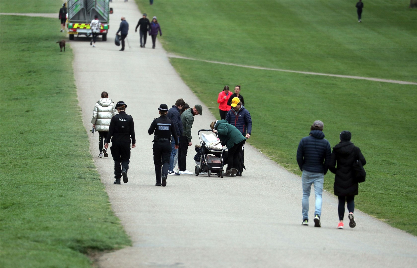 Police officers monitor the crowds on the Long Walk at Windsor (Steve Parsons/PA)