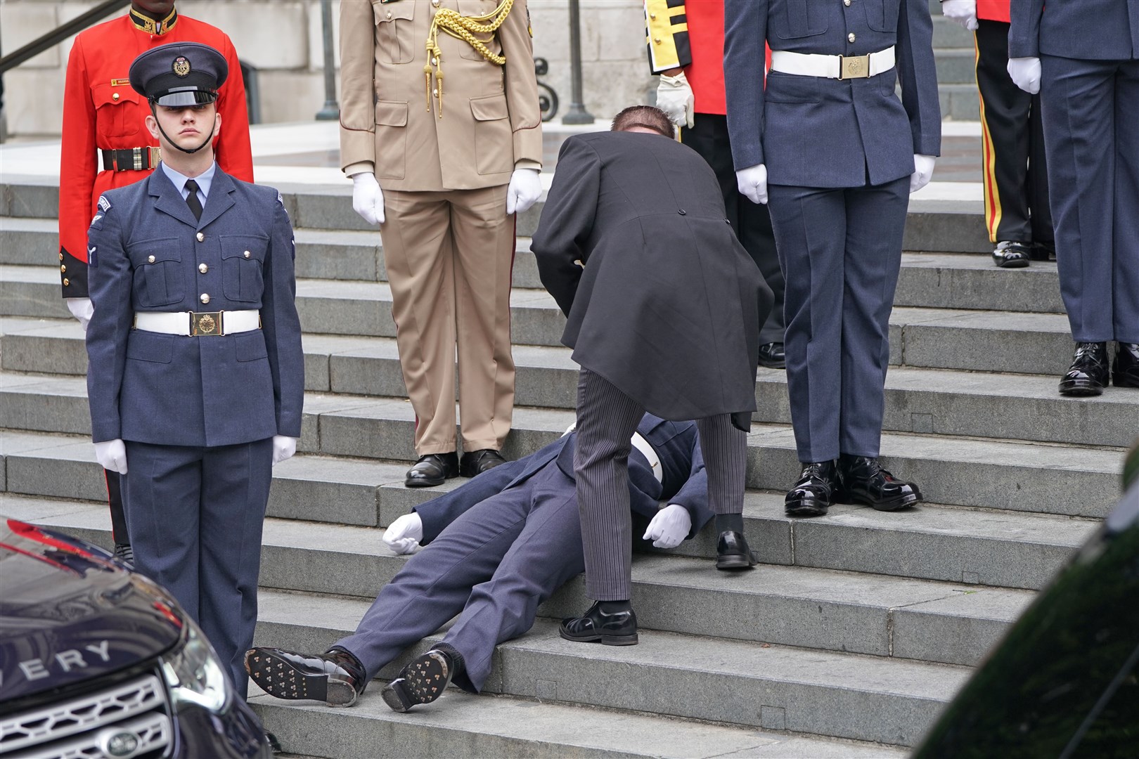 A Military personnel faints ahead of the National Service of Thanksgiving at St Paul’s Cathedral (Kirsty O’Connor/PA)