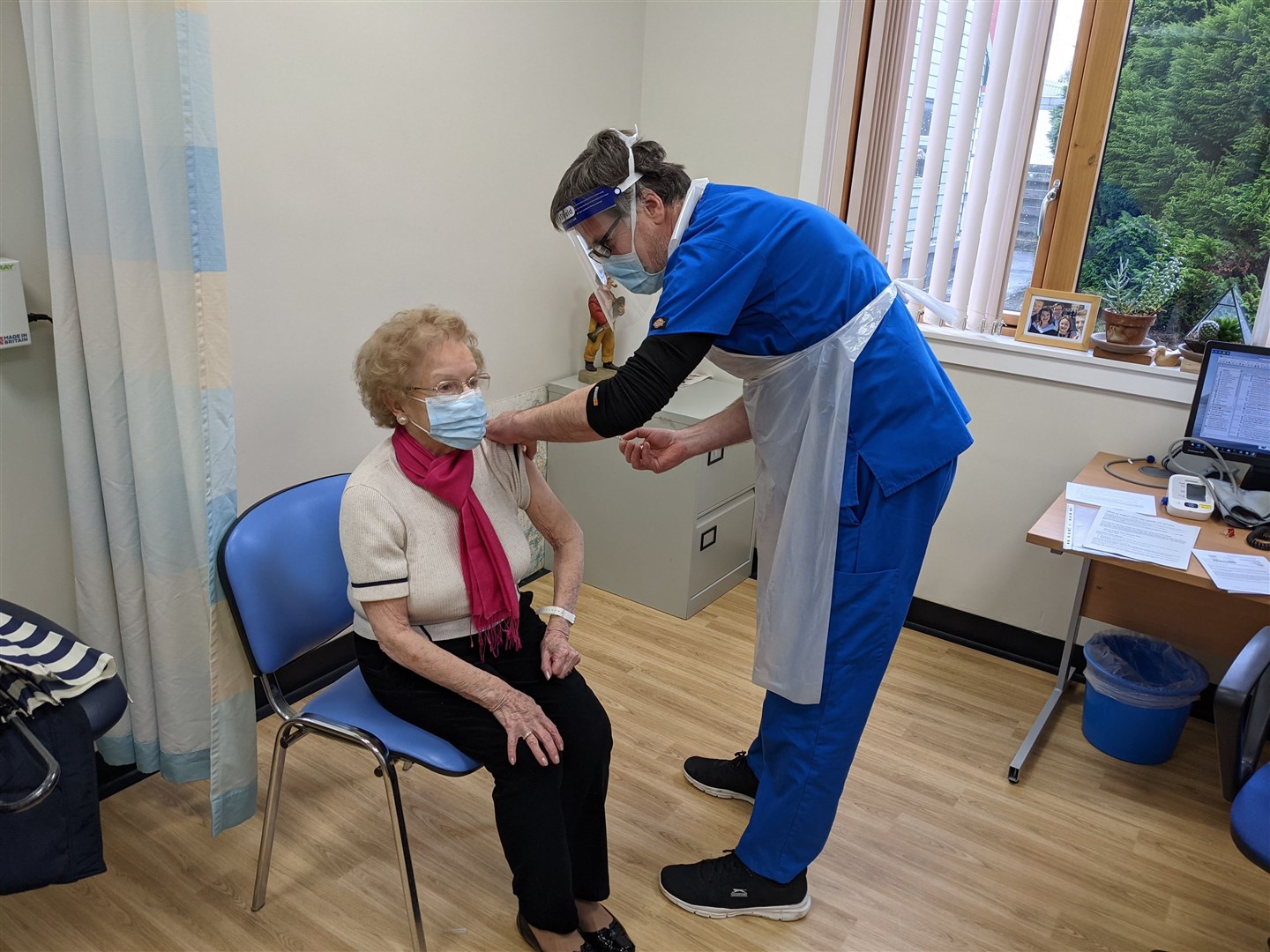 Patsy Maclennan of Dingwall getting the vaccine from Dr Miles Mack at an earlier session.