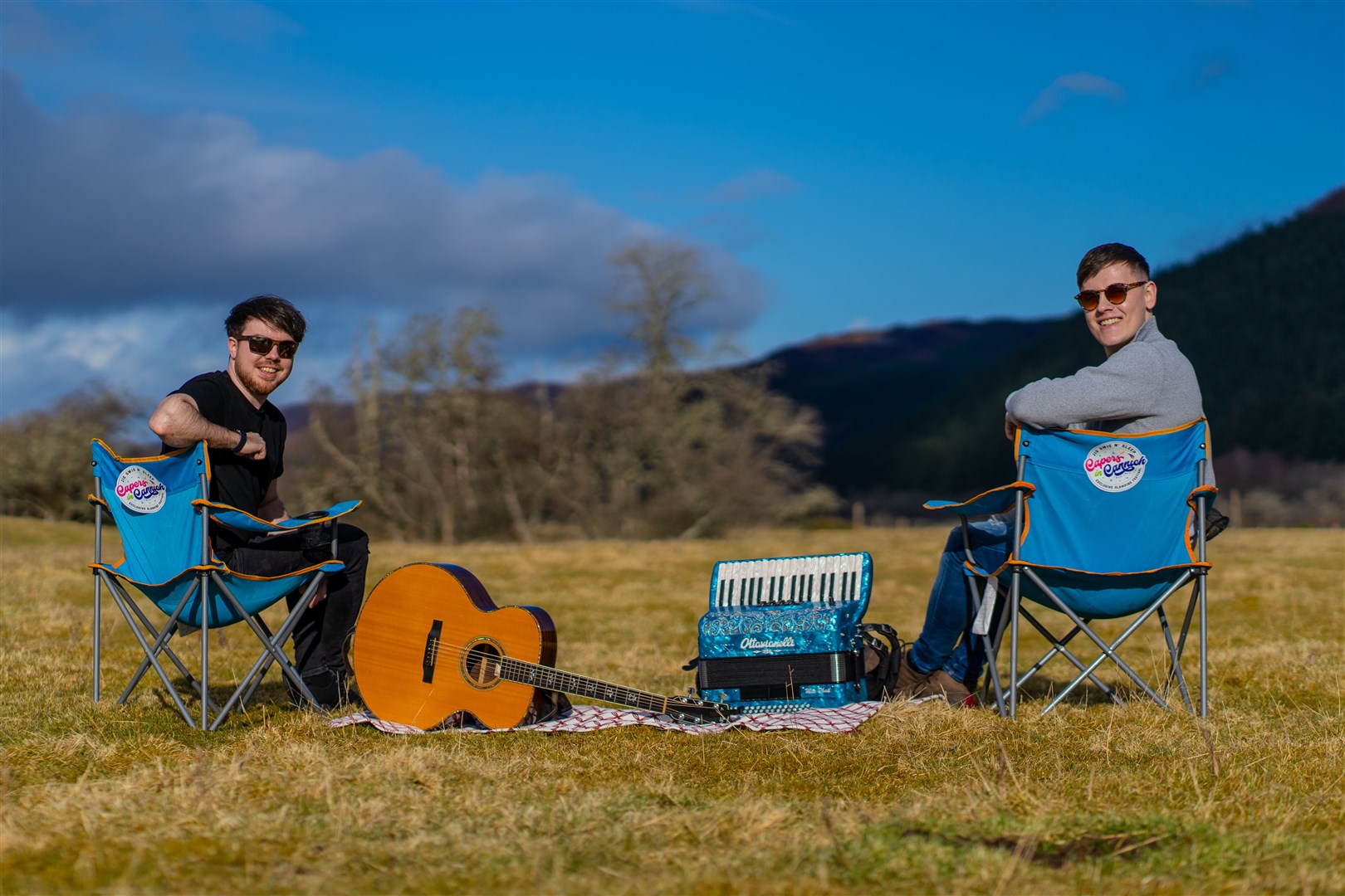 Bandmates Calum MacPhail and Sean Cousins of headline band Hò-rò on the Capers in Cannich festival site.