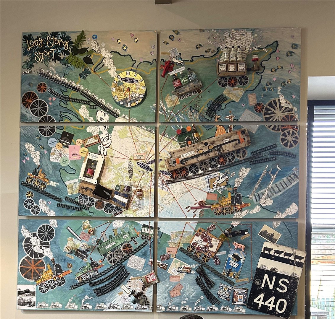 The new mural is made up of six wooden panels, painted and with items attached to represent local businesses.