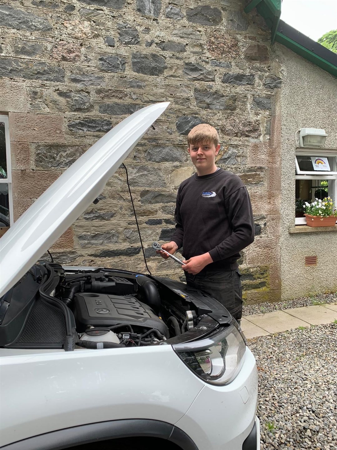 Connor MacLeod from Marybank received help in training to be a car mechanic in Beauly.