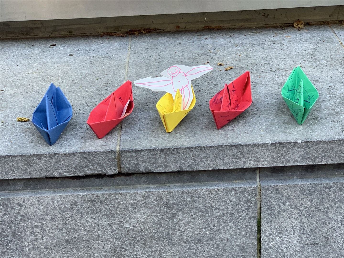 Extinction Rebellion demonstrators placed paper boats outside the Home Office (Lucas Cumiskey/PA)