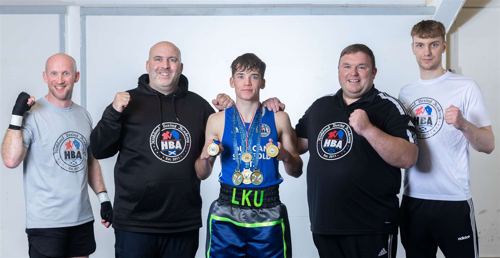 Lewis Urquhart paid tribute to his coaches at Highland Boxing Academy – in particular club head coach Liam Foy (second left). Picture: David Rothnie