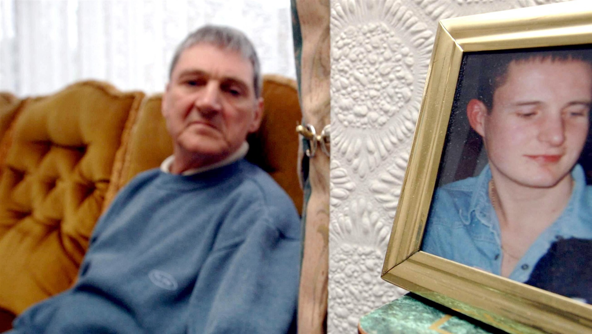 Terry Lubbock, with a photo of his son Stuart at right, had recently been pushing for a fresh inquest (PA)