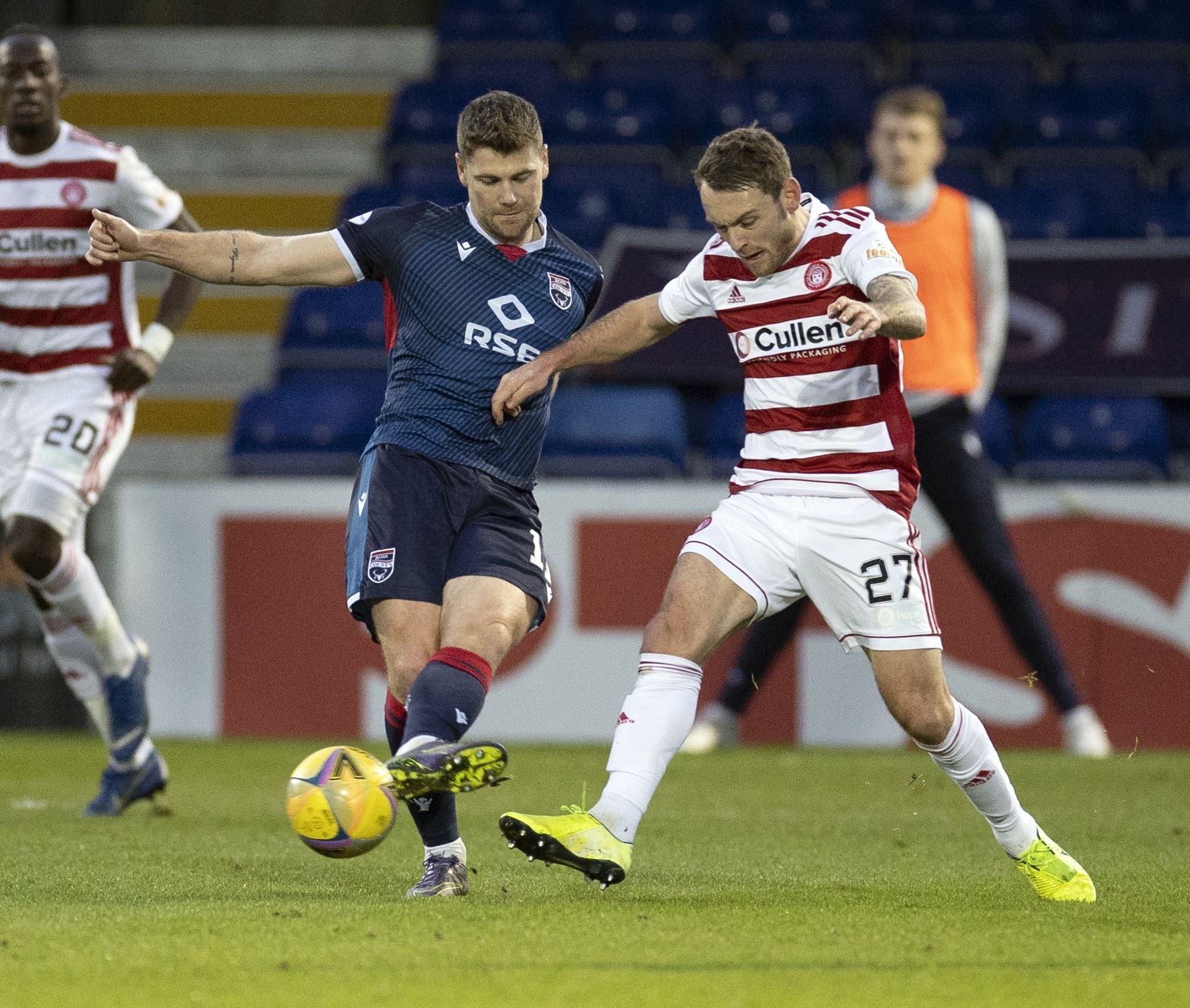Picture - Ken Macpherson, Inverness. Ross County(0) v Hamilton(2). 19.12.20. Ross County's Iain Vigurs clears from Hamilton's Lee Hodson.