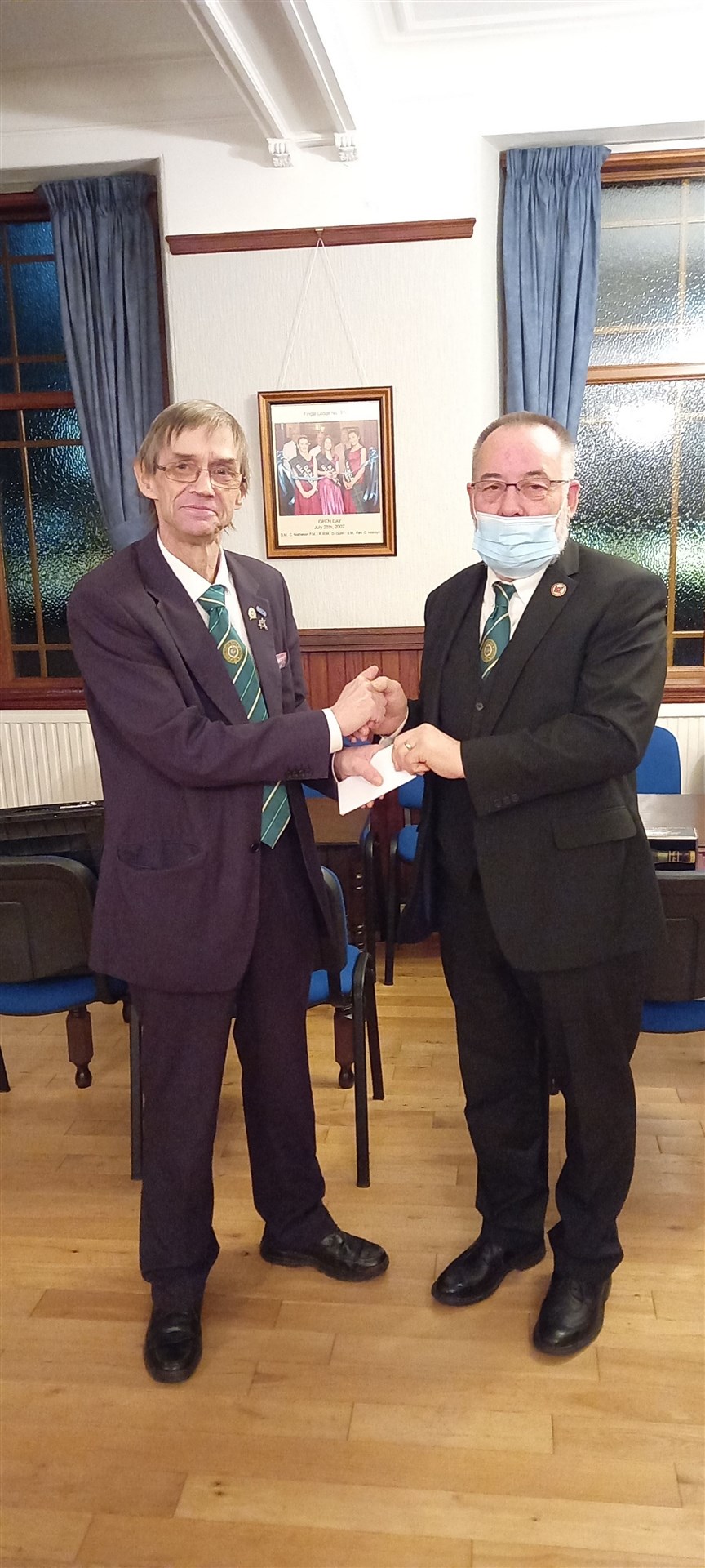 Master of Lodge Averon 866 Bro Charlie Carrison in Alness with George Robinson.