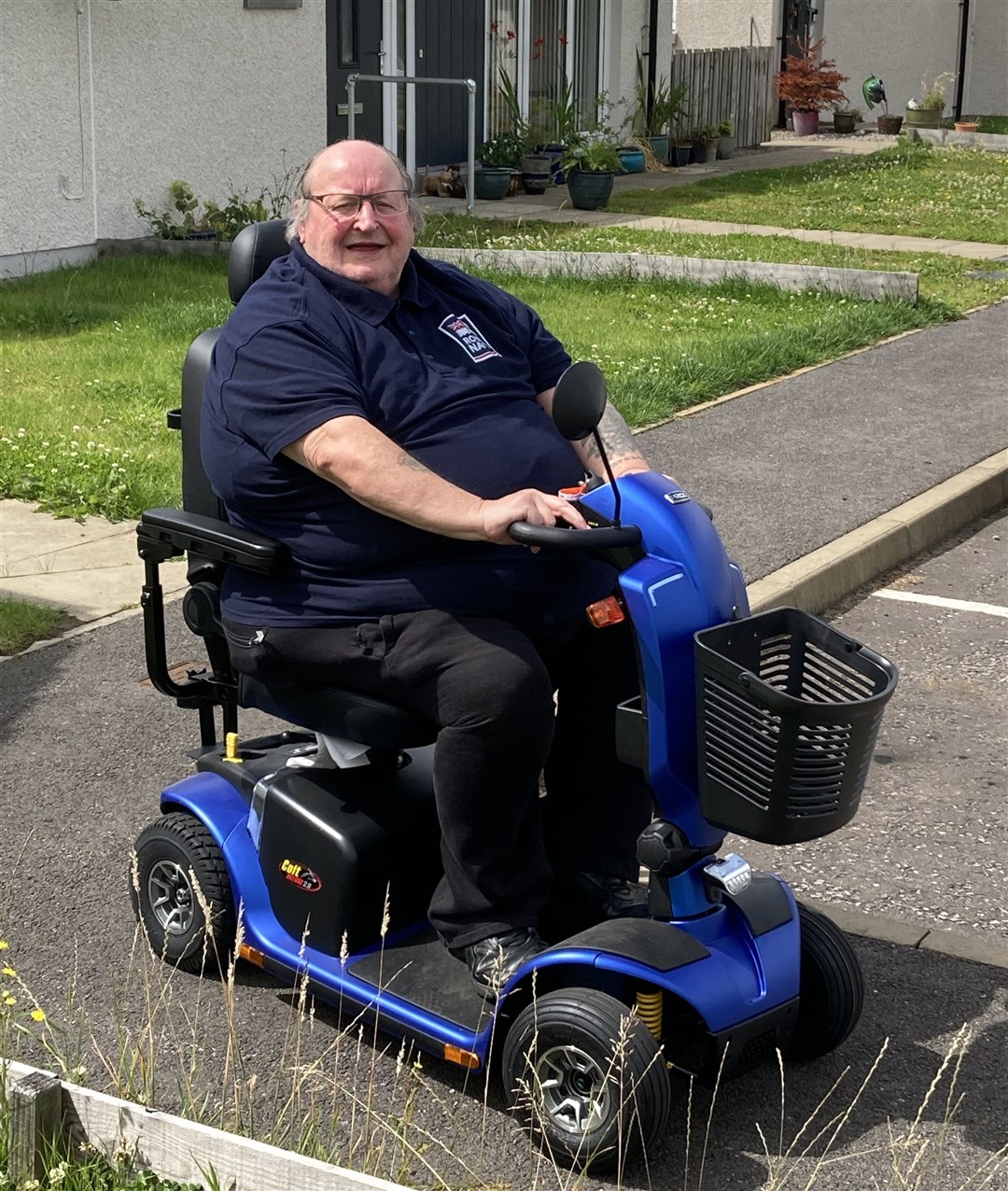 Mr Thomas says the mobility scooter has made his life considerably better.