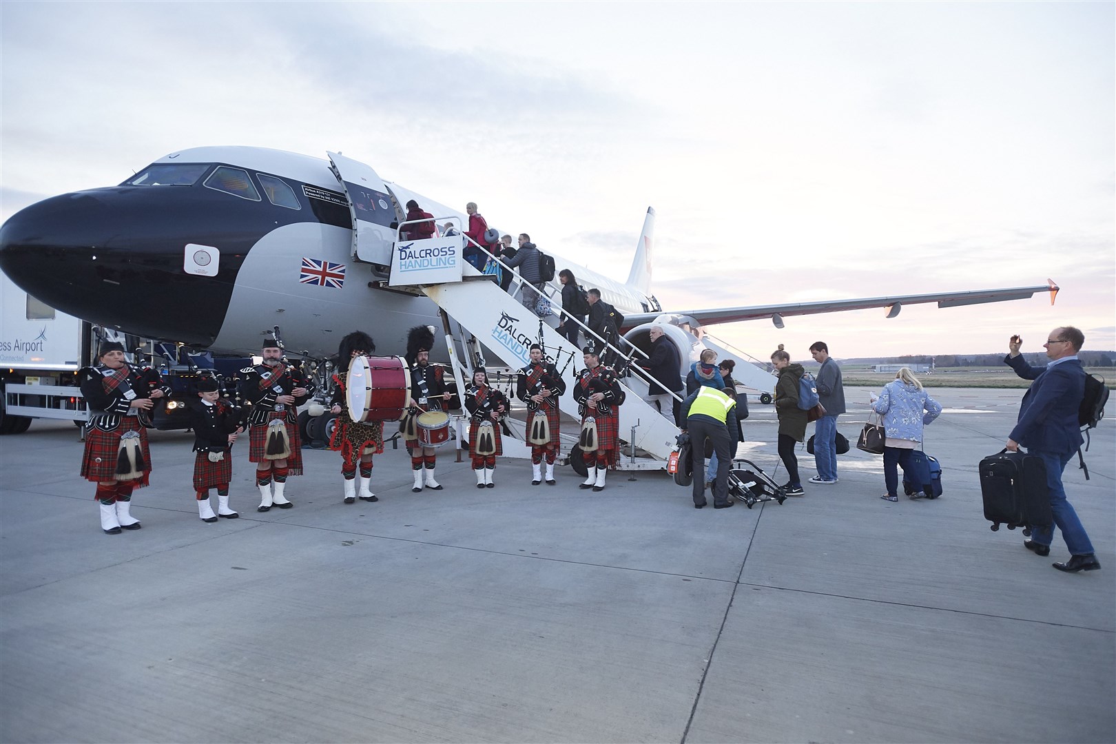 The first early morning BA Inverness-Heathrow flight in 2019 was marked with a pipe band performance.