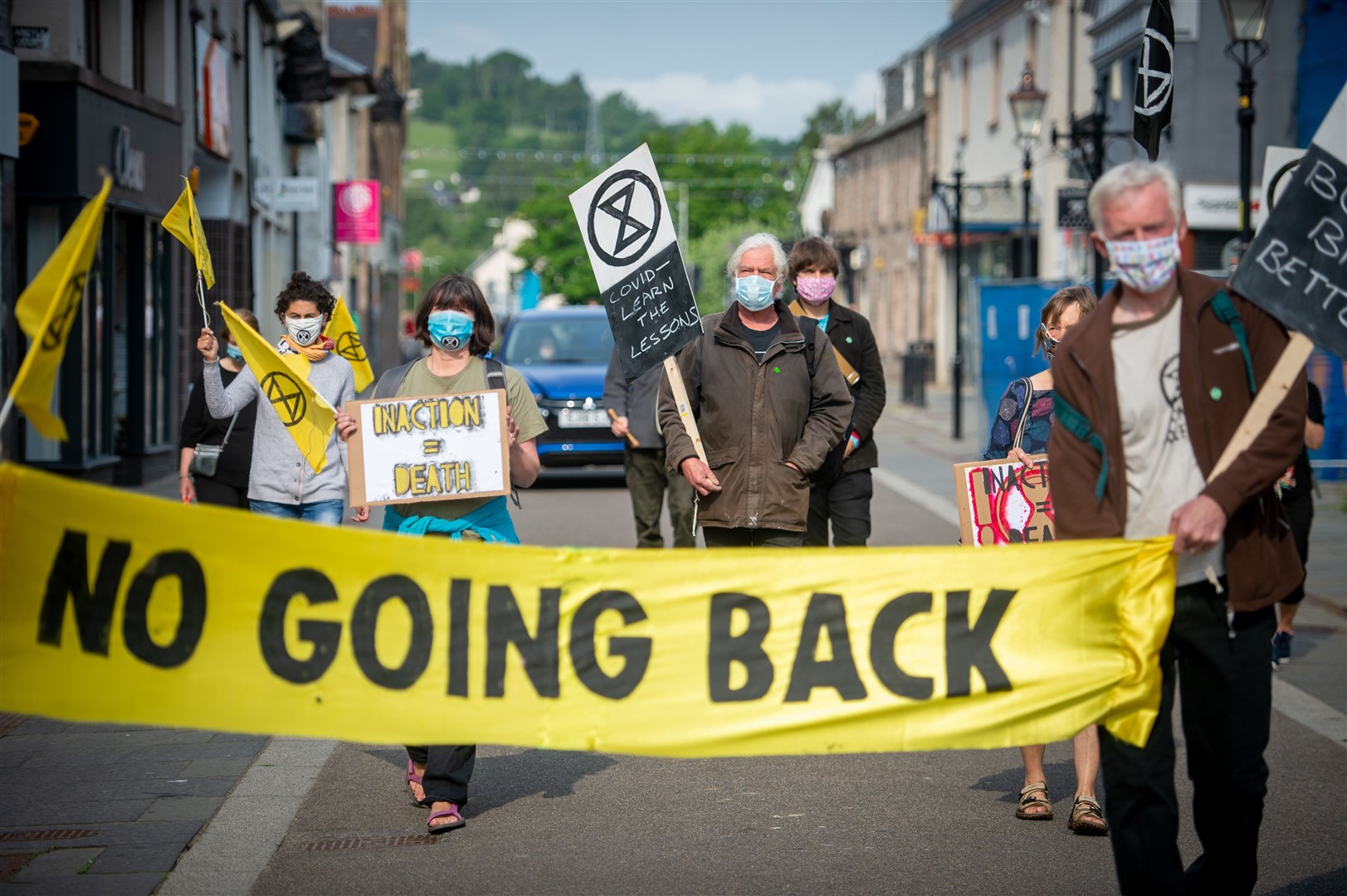 Extinction Rebellion, High Street, Dingwall. A slow march down the street to the beat of a drum. Picture: Callum Mackay