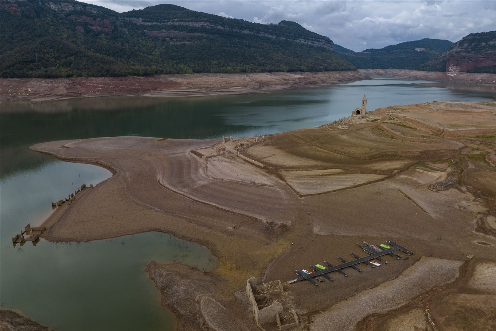 The Sau reservoir, 100km north of Barcelona, during a drought earlier this year (Emilio Morenatti/AP/PA)