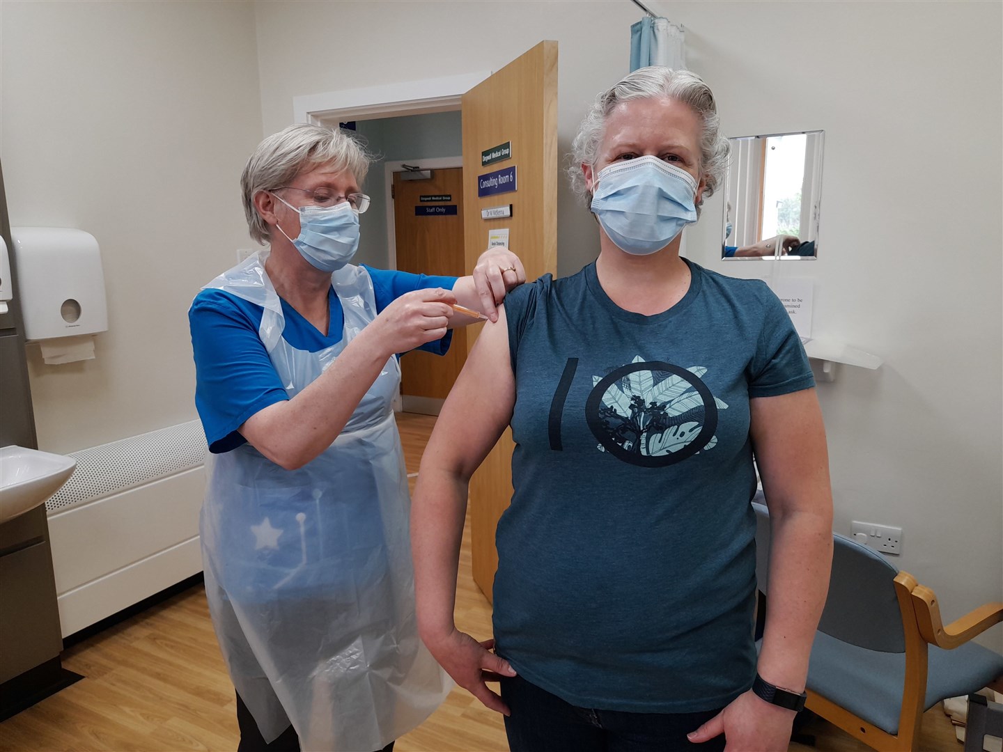 Dr Moira McKenna vaccinates a patient from Dingwall Medical Group during one of the local clinics.