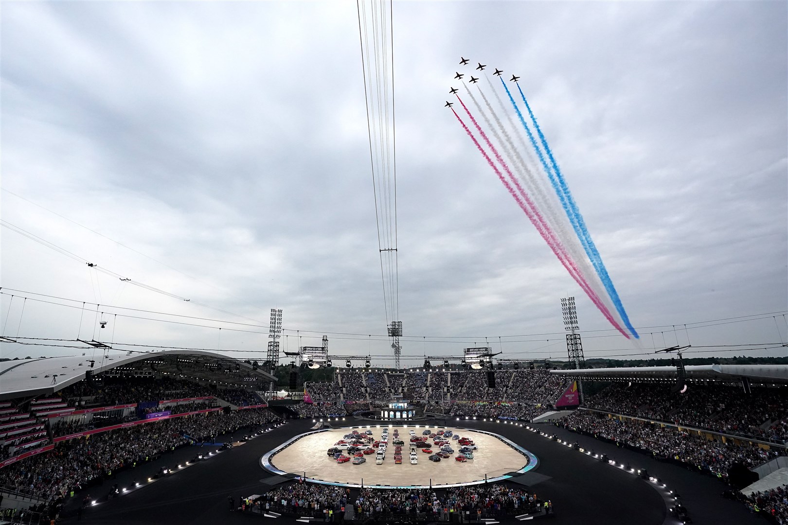 The Red Arrows flypast goes over the stadium during the opening ceremony of the Birmingham 2022 Commonwealth Games at the Alexander Stadium, Birmingham (Zac Goodwin/PA)