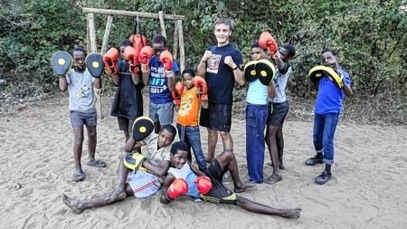 Ali Macleod pictured with his students at Bana Ba Metsi in Botswana with the boxing equipment sent from Knockbain Free Church.
