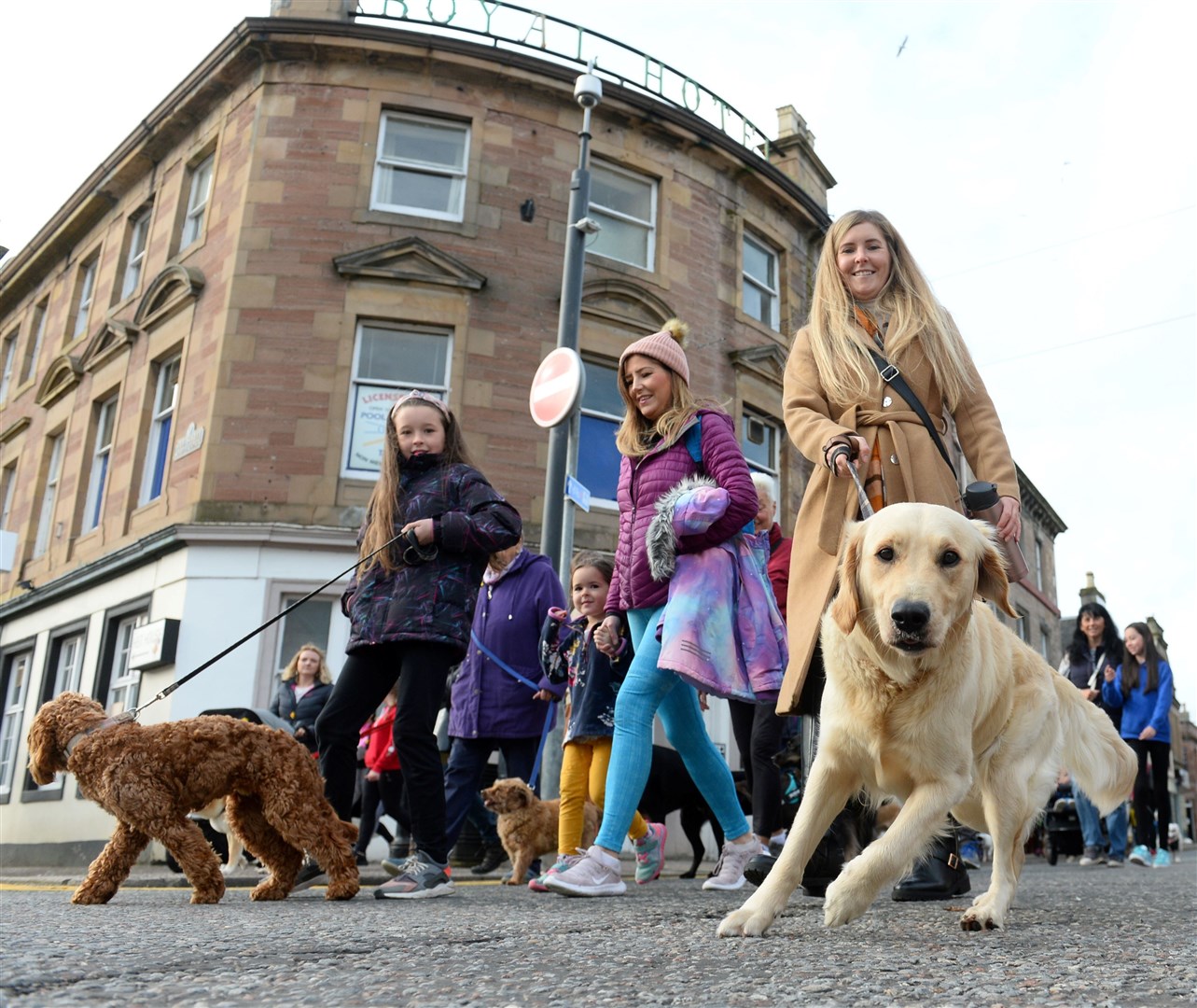 Gary gets down for a fresh angle on a Marie Curie Dingwall dog parade! Picture Gary Anthony.