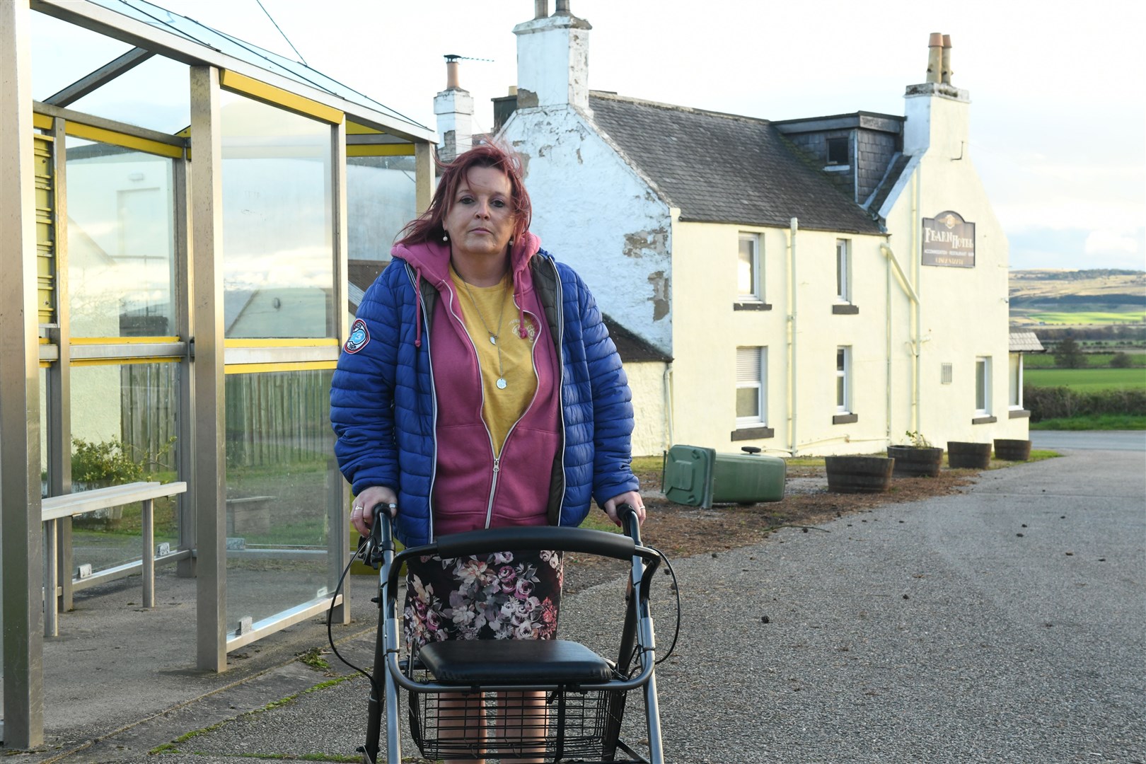 Nickie Steven with her rollator outside the bus stop in Fearn. Picture: James Mackenzie.