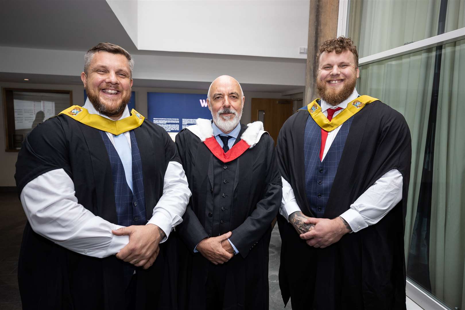 Head teacher Chris O'Neil is pictured with Stoltman brothers Luke and Tom