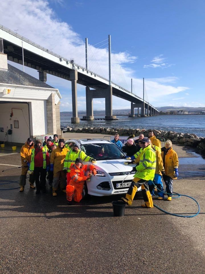 The Kessock Lifeboat Station team at a car wash event.